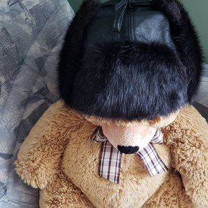 Leather and Musque rat fur hat.